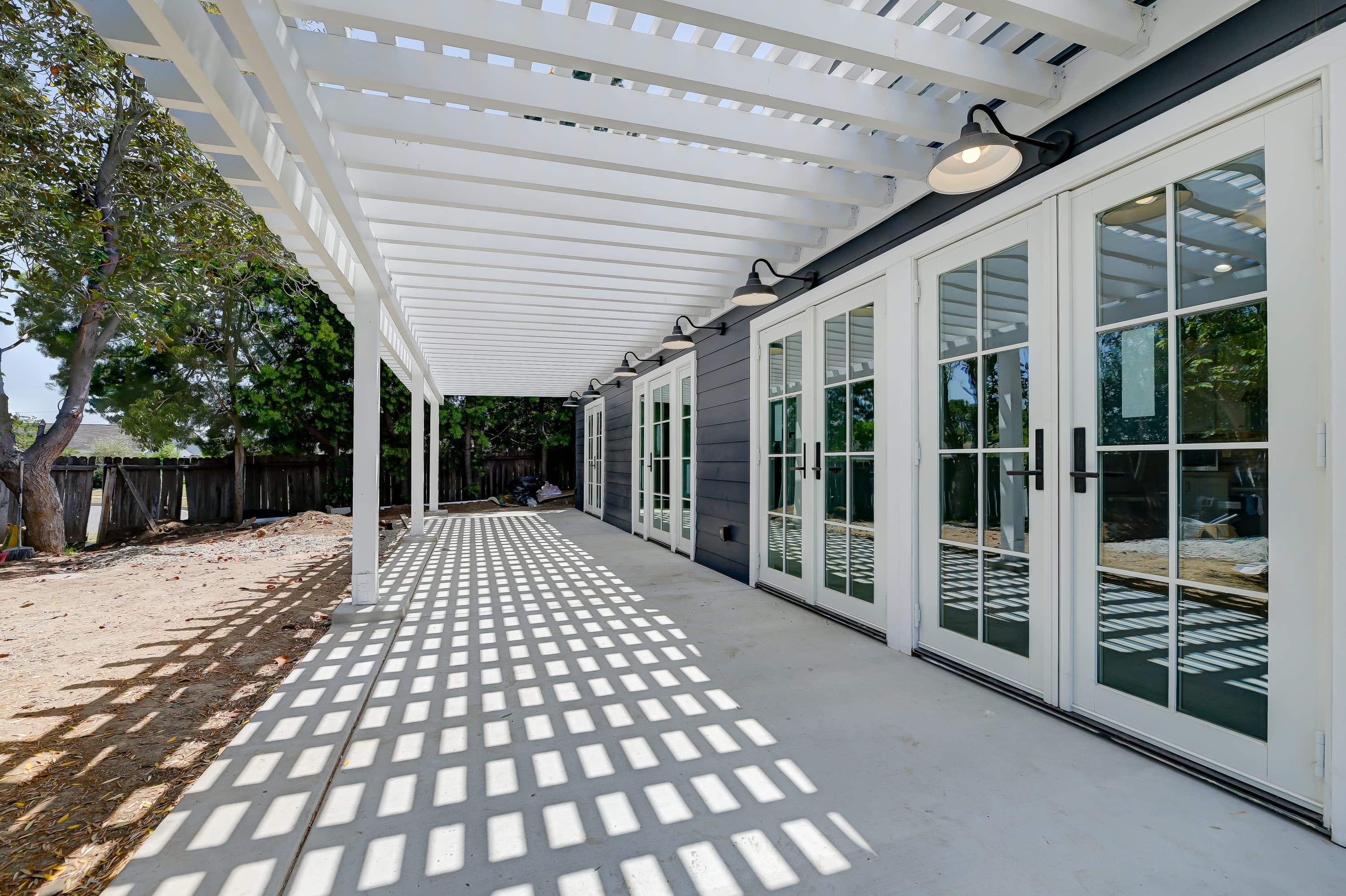 Custom covered pergola and patio addition with French doors by Navarro's Custom Homes & ADUs in Southern California